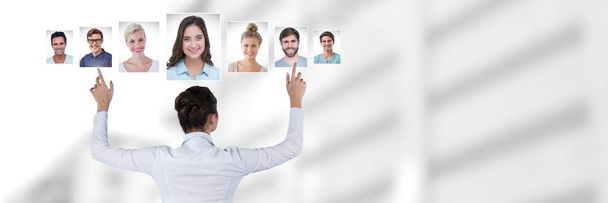 Digital composite of Woman touching portrait profiles of different people - Foto, Imagem