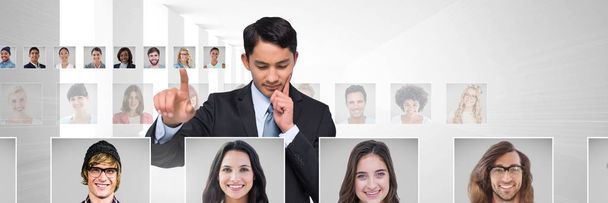 Digital composite of Man touching portrait profiles of different people - Φωτογραφία, εικόνα