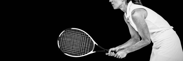 Athlete playing tennis with a racket on white background - Photo, image