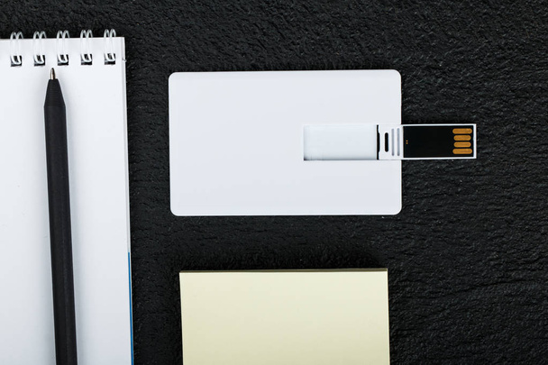white card. Office desk wooden background top view mock up - 写真・画像
