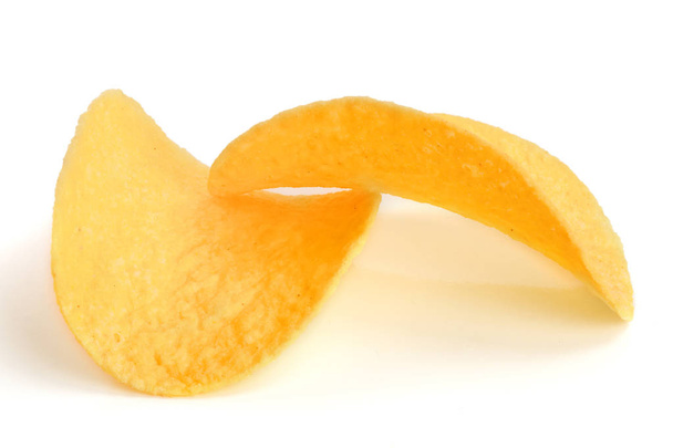 two potato chips on white background close-up - Foto, imagen