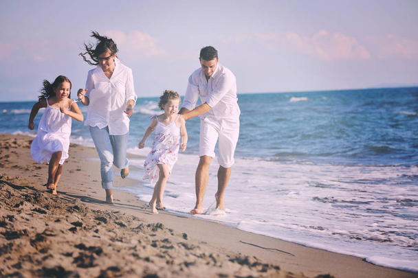 happy young family in white clothing have fun at vacations on beautiful beach  - Φωτογραφία, εικόνα