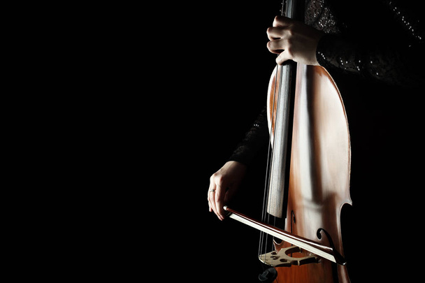 Cello player. Cellist hands playing cello with bow - Фото, изображение