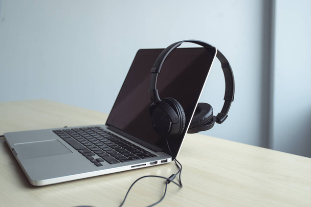 Laptop and headphones on the table - Fotografie, Obrázek