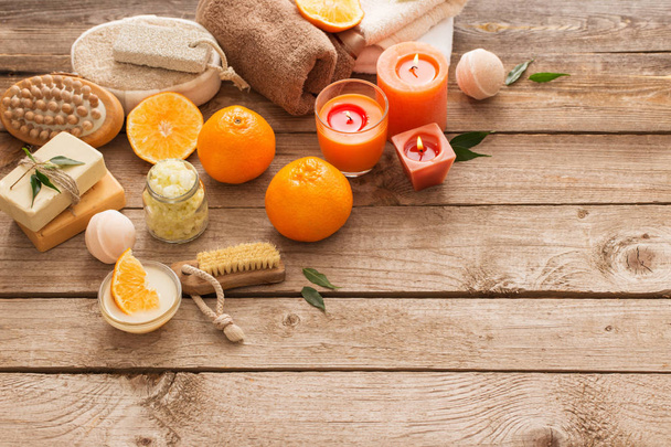 spa concept with orange fruits on old wooden background - Foto, Bild
