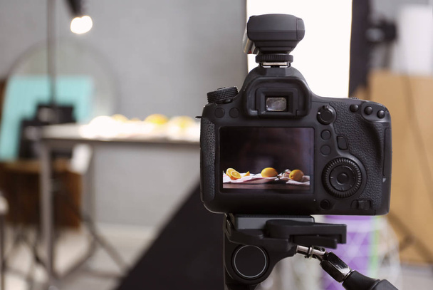 Professional camera on tripod in studio, closeup. Food photography - 写真・画像