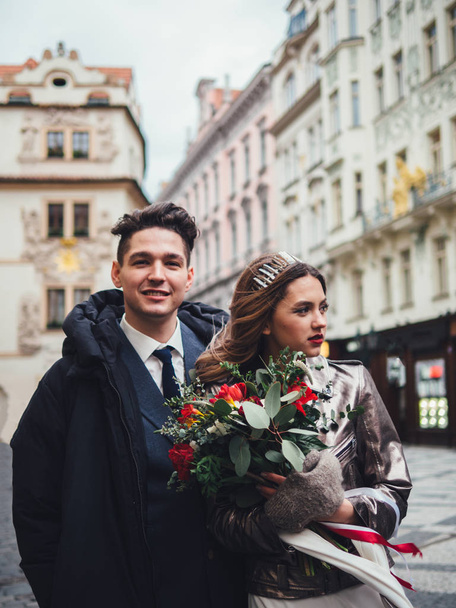 Groom and bride in historic centre of Prague. Wedding - 写真・画像