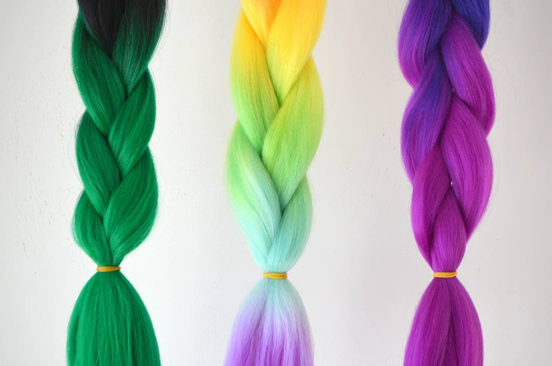 Kanekalon. Colored artificial strands of hair. Material for plaiting braids - Photo, Image