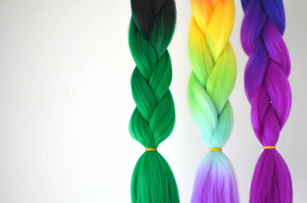 Kanekalon. Colored artificial strands of hair. Material for plaiting braids - Photo, Image