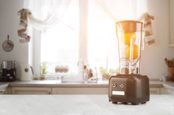 The electric blender for make fruit juice or smoothie. Sun flare - Photo, Image