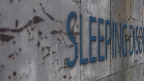 Close up Shooting concrete wall with word sleeping disorder - Footage, Video