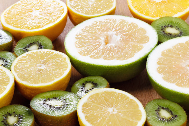 Citrus fruits healthy food, orange, lemon and kiwi - Foto, Bild