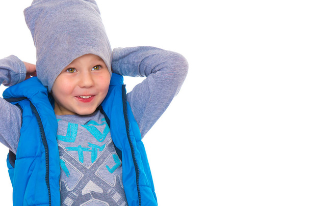 A little boy in a jacket and hat. - Zdjęcie, obraz