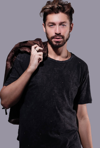 Portrait of a trendy bearded man on a gray background - Zdjęcie, obraz