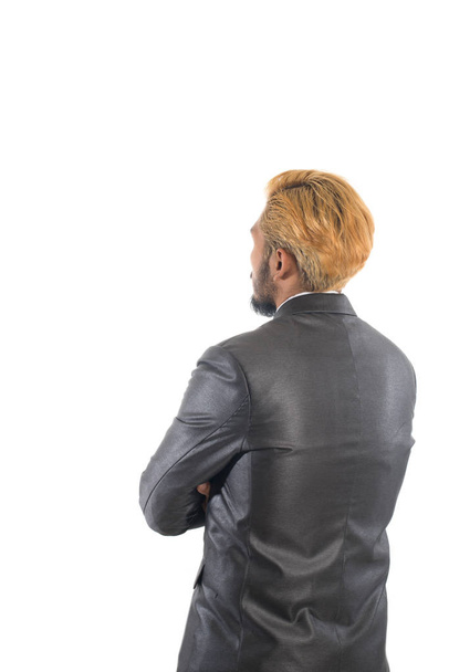 Rear of businessman looks ahead. Isolated over white background. - Photo, Image