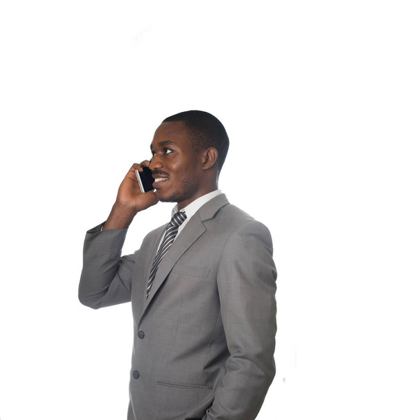 Young entrepreneur talking on cell phone isolated on white. - Фото, зображення