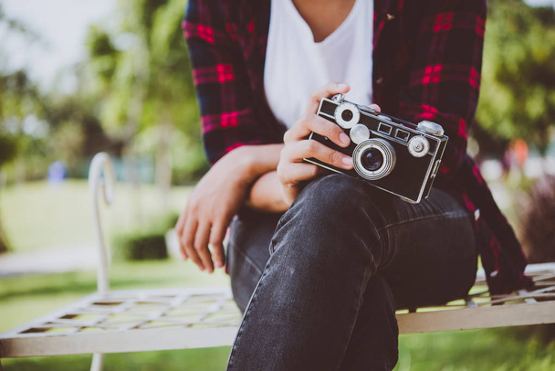 Close-up of hipster woman with vintage camera. - Foto, Imagen