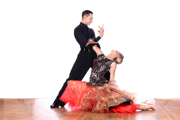 Latino dancers in ballroom against white background - Foto, Imagen