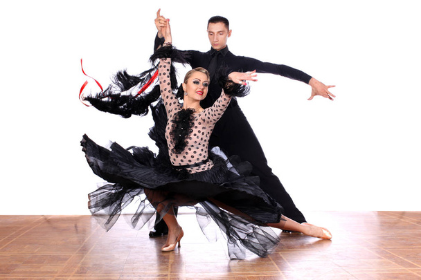 Latino dancers in ballroom against white background - Foto, Imagen