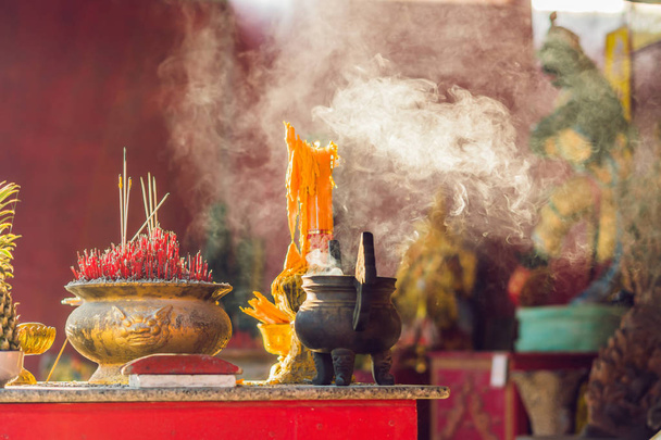 Incense sticks on joss stick pot are burning and smoke use for pay respect to the Buddha, respect to the Buddha in Buddhism life Pray in buddha. - Photo, Image