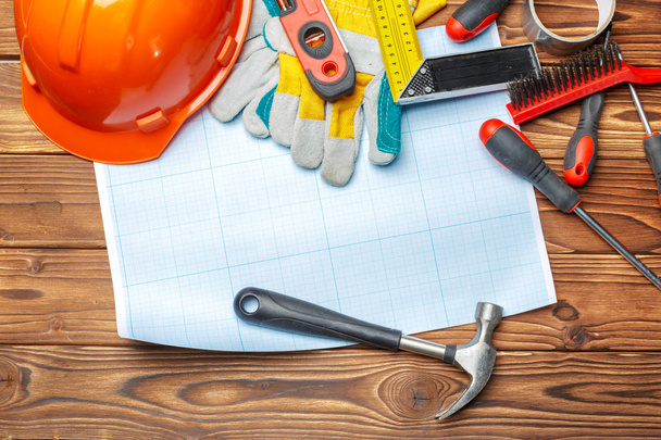 Variety of work tools on wooden background - Фото, зображення