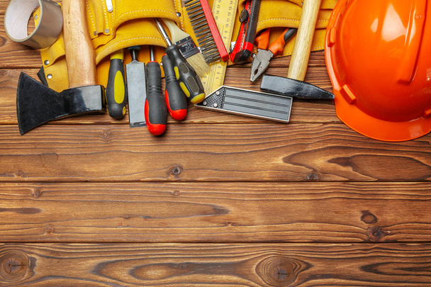 Variety of work tools on wooden background - Photo, Image