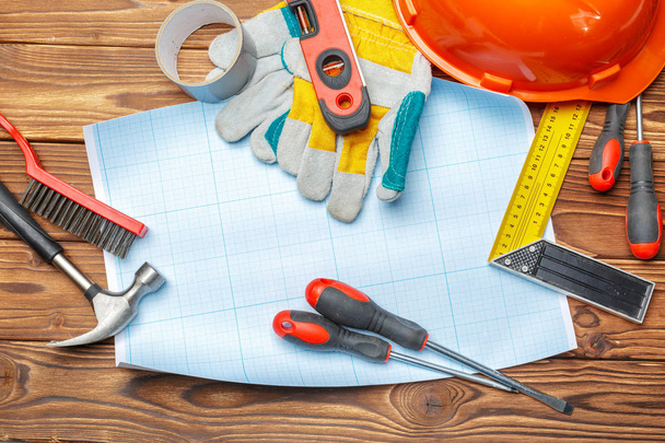 Variety of work tools on wooden background - Фото, зображення