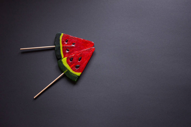 Lollipops in the shape of a red juicy watermelon - Fotó, kép