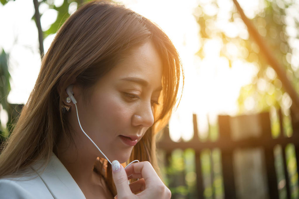 beautiful business woman listening music for relax from work - Foto, immagini