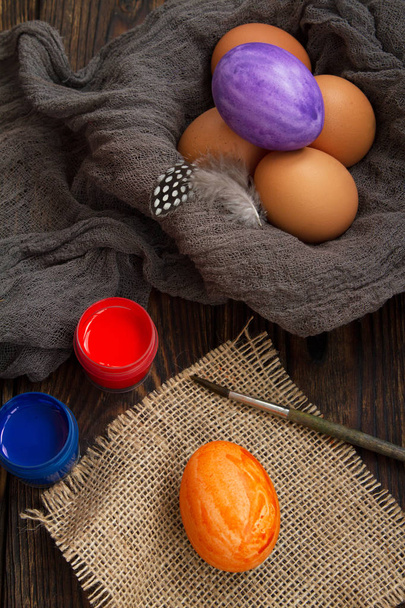 preparation for coloring Easter eggs on a wooden table - Photo, Image