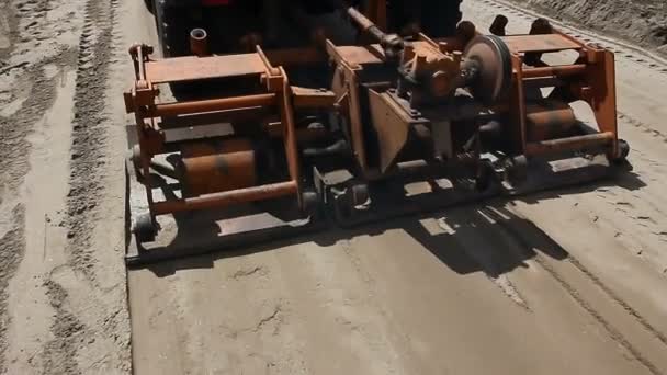 Plate compactor mounted on truck.Plate compactor is mounted to the truck, compacting sand at road construction site. - Footage, Video