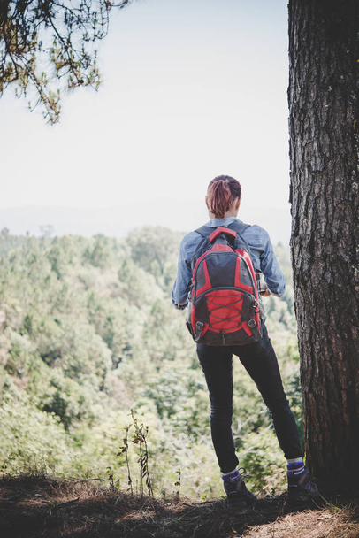 Hiker with backpack on top of a mountain,Freedom and active life concept. - Photo, Image