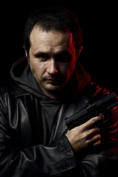 Gangster, man with a gun ready to shoot - Fotografie, Obrázek