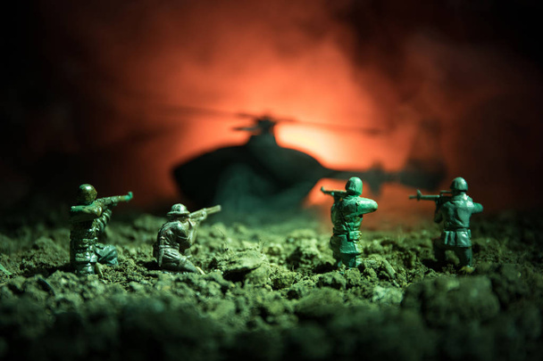 War Concept. Military silhouettes fighting scene on war fog sky background, World War Soldiers Silhouettes Below Cloudy Skyline At night. Attack scene. Armored vehicles. Tanks battle. - Photo, Image