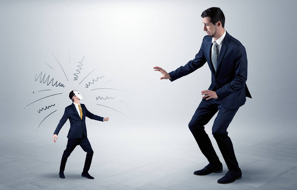 Conflict between small and big businessman - Foto, imagen