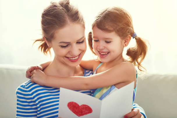 Happy mother's day! Child daughter congratulates moms and gives  - Photo, image