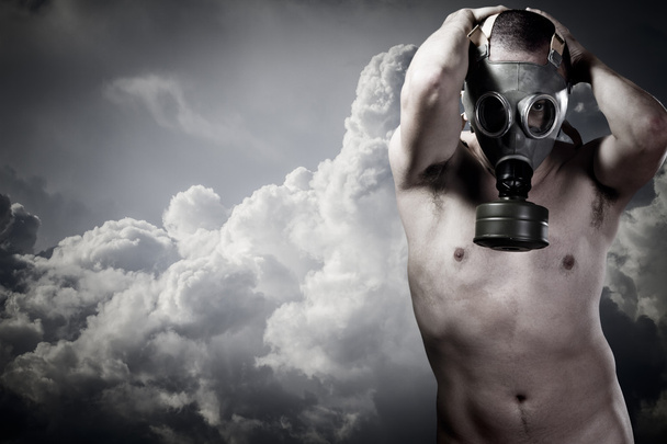 pollution concept: portrait of nude man in a gas mask - Foto, imagen