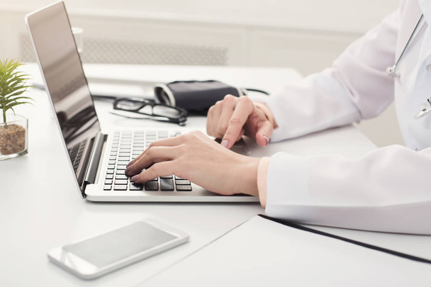 Doctor hands typing on laptop closeup - Φωτογραφία, εικόνα