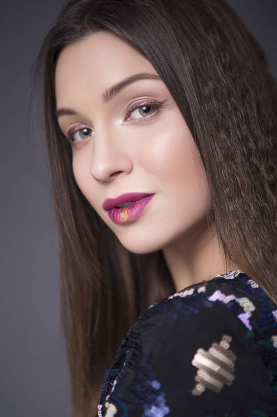 Caucasian brunette woman with creative make up (sequins and glit - Fotografie, Obrázek