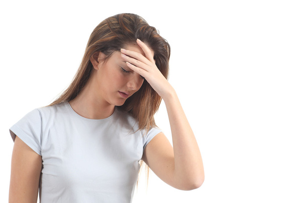 Woman with a headache and her hand in forehead - Photo, image