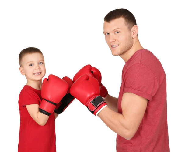 Happy dad and his son boxing on white background. Father's day celebration - Foto, Imagen