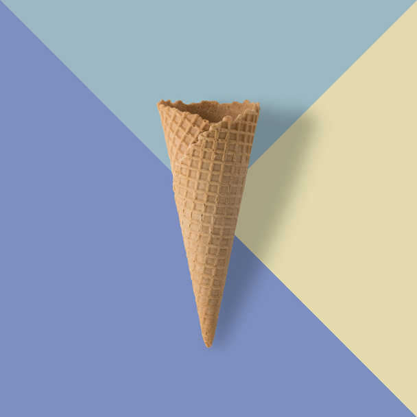 Ice cream cone on pastel colorful background.  - Foto, afbeelding