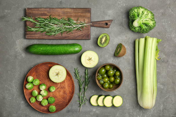 Flat lay composition with green vegetables and fruits on grey background. Food photography - Foto, immagini
