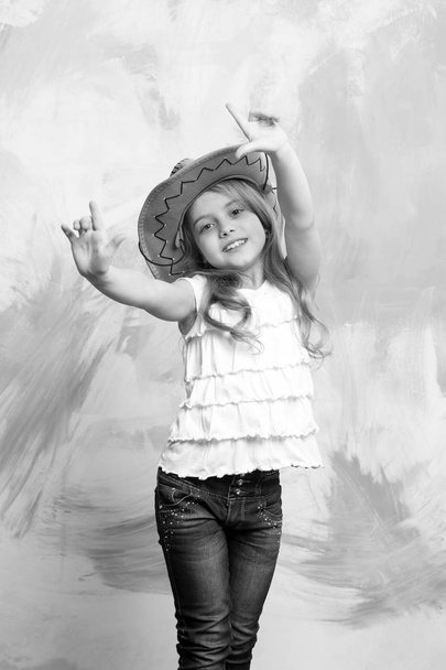 child or little happy smiling girl in cowboy hat - Foto, immagini