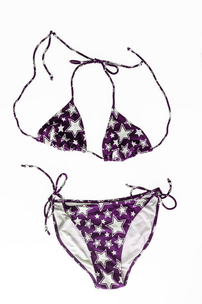 multi-colored beach bikini with fashionable pattern in stars iso - Photo, Image