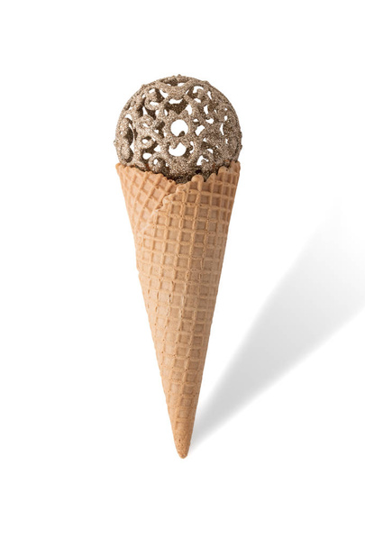Ice cream cone with christmas ball on white background. - Foto, afbeelding
