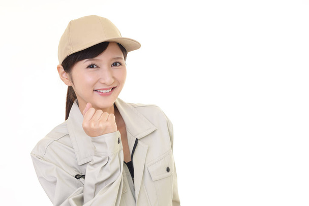 Smiling female worker isolated on white background - Photo, Image