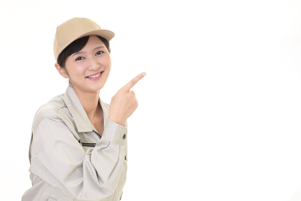 Female worker pointing with her finger - Photo, Image