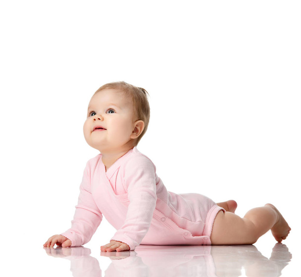 8 month infant child baby girl toddler lying in white shirt looking up  - Φωτογραφία, εικόνα