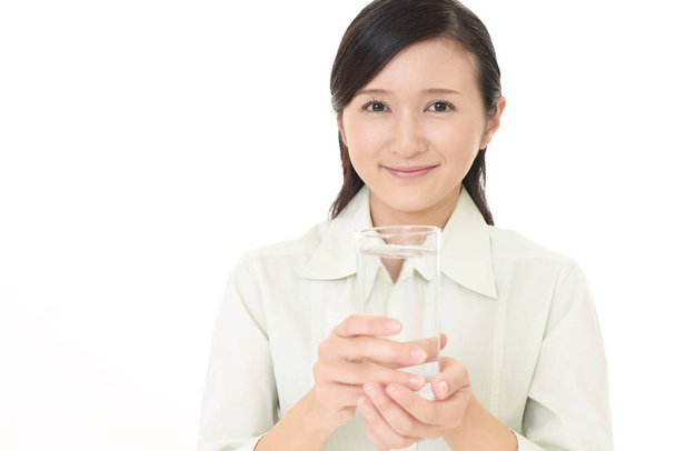 Woman with a glass of water - Zdjęcie, obraz